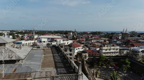 AERIAL view of the Stone Town, old part of Zanzibar City. Flight above main city of Zanzibar, Tanzania, Africa, Indian Ocean, 4k UHD photo