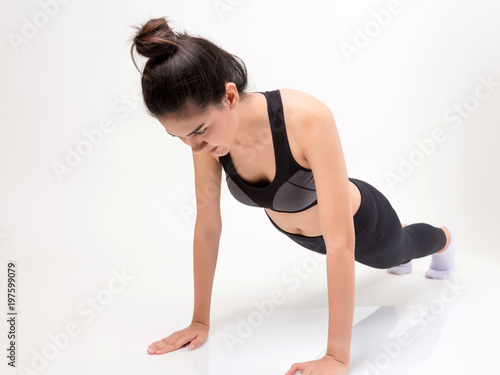 Happy young fitness woman. Studio shot on white background. Fitness and health concept