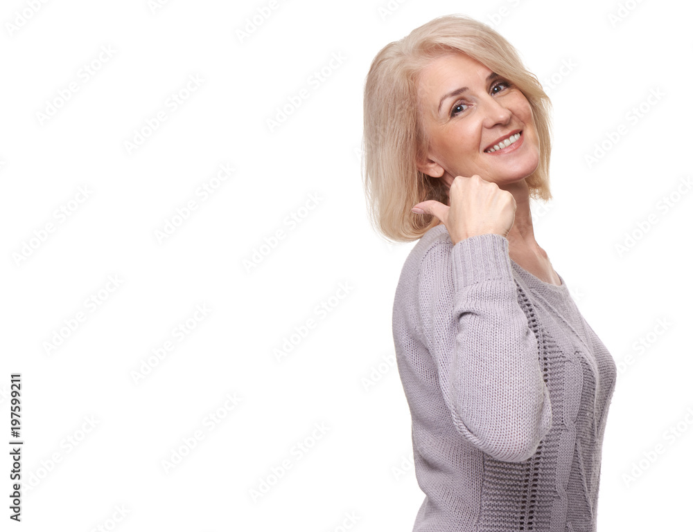 middle aged woman pointing at white background middle aged woman pointing at white background