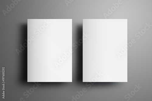 Two universal blank closed A4, (A5) brochures with soft realistic shadows  isolated on gray background. Top of view.