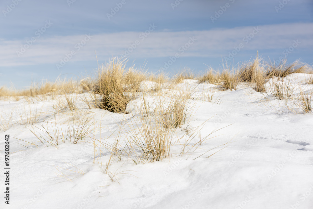Snowy landscape against cloudy sky Snowy landscape against cloudy sky