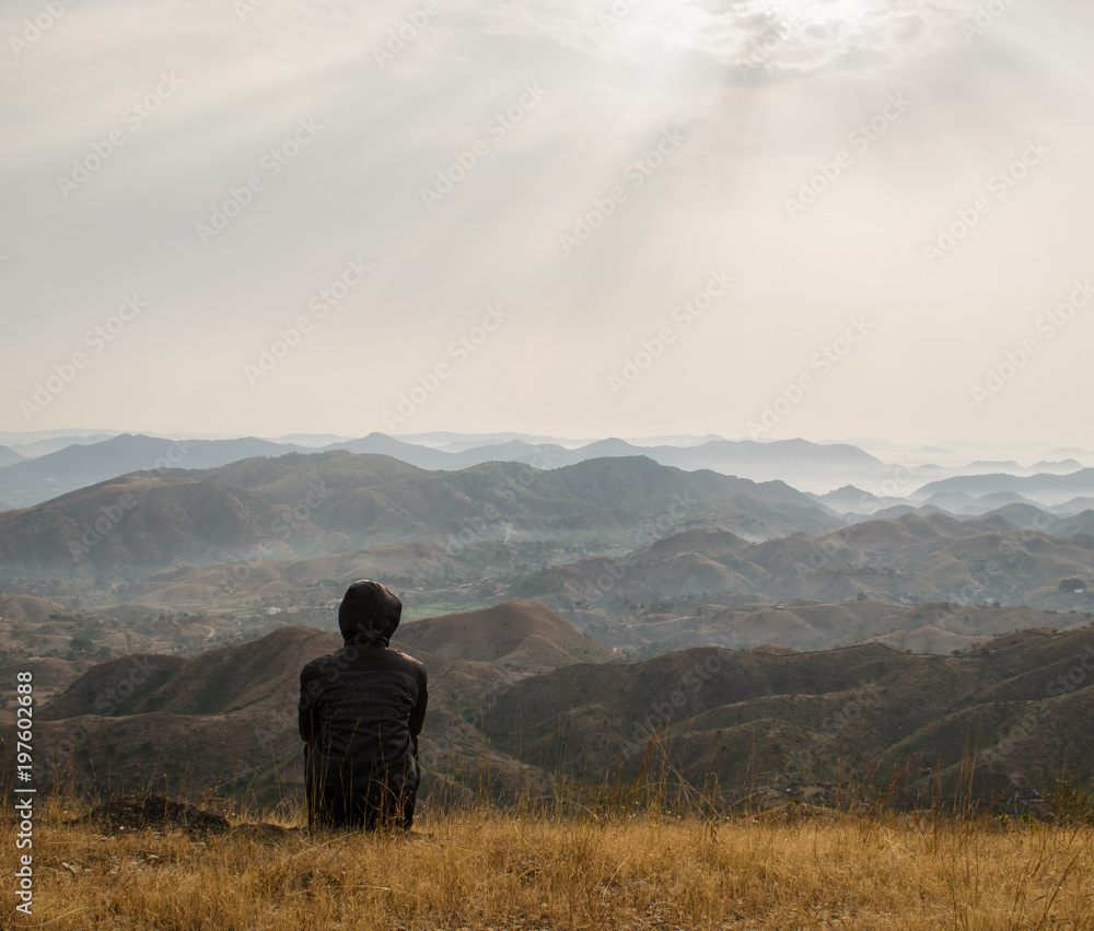 Man enjoying the view on the top of hills