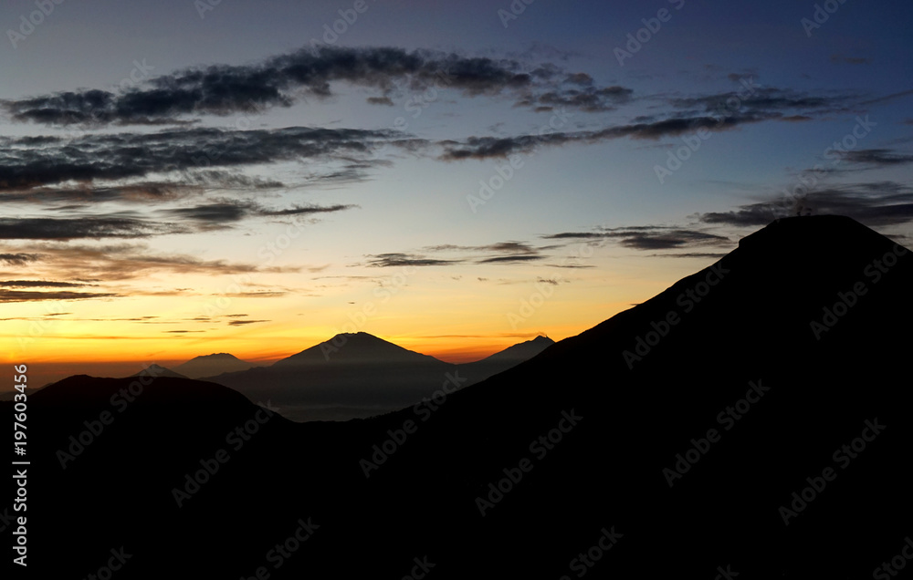 Silhouette of Prau mountain before sunrise. Dieng Plateau, Indonesia.