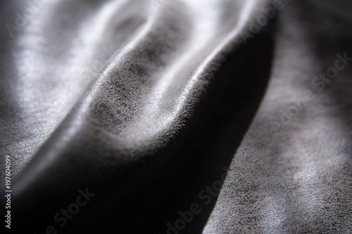 Dented fabric with texture highlighted by light