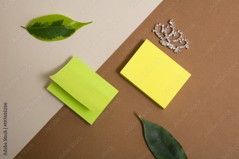 Green and yellow blocks of sticky paper on a delimited background. Green and yellow blocks of sticky paper on a delimited background.