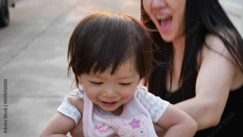 slow-motion, mother throwing cute child in happy play time slow-motion, mother throwing cute child in happy play time