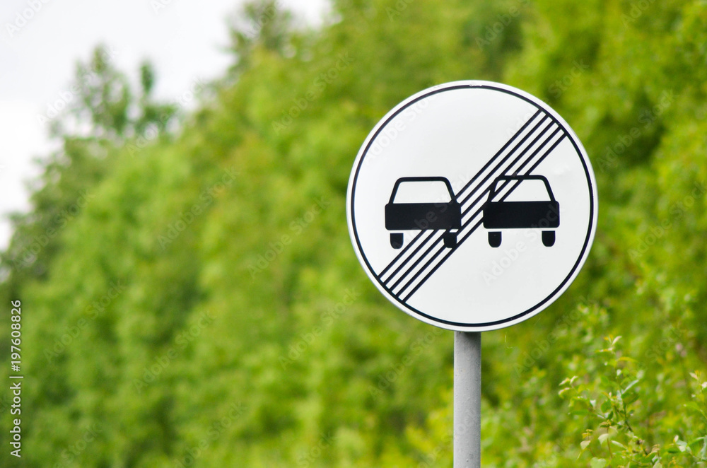 Traffic sign end of prohibition of overtaking in suburban highway Stock ...
