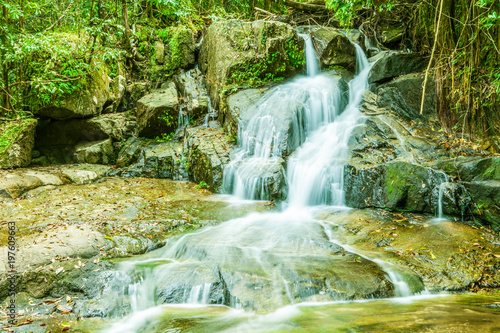 Fototapeta Naklejka Na Ścianę i Meble -  Tropical waterfall in the forest,Ton Chong Fa  in khao lak Phangnga South of Thailand