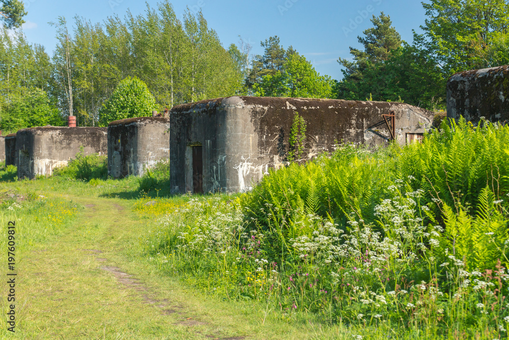 Old abandoned concrete fortification construction on a bright summer day on Vallisaari island in Finland Old abandoned concrete fortification construction on a bright summer day on Vallisaari island in Finland