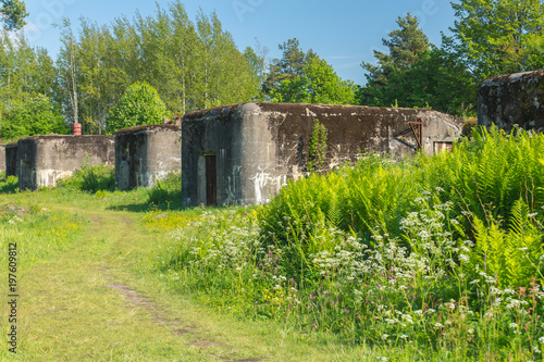 Old abandoned concrete fortification construction on a bright summer day on Vallisaari island in Finland