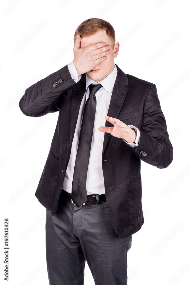 portrait young businessman covering his eyes with his hand. emotions, facial expressions, feelings, body language, signs. image on a white studio background. portrait young businessman covering his eyes with his hand. emotions, facial expressions, feelings, body language, signs. image on a white studio background.