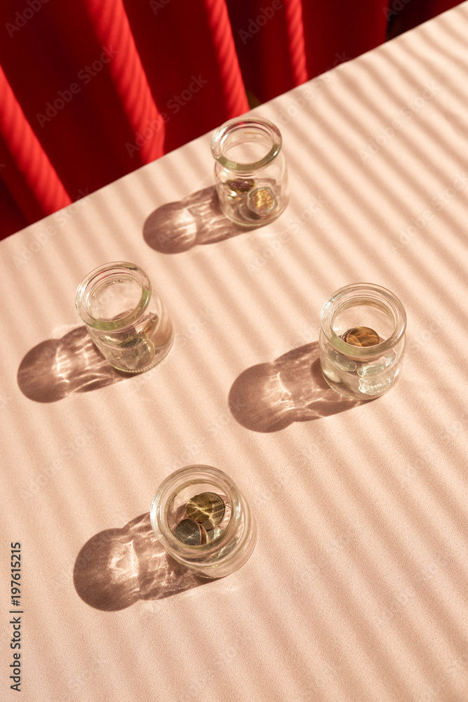 Coins in glass jar. Money savings concept Coins in glass jar. Money savings concept