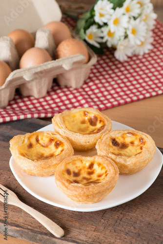 Egg tart on wood table.