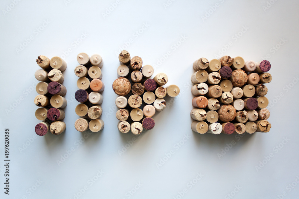 Wine corks pause, play and stop button shapes isolated on white background from a high angle view Wine corks pause, play and stop button shapes isolated on white background from a high angle view