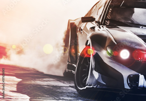 Blurred sport car drifting on speed track. Sport car wheel drifting and smoki...