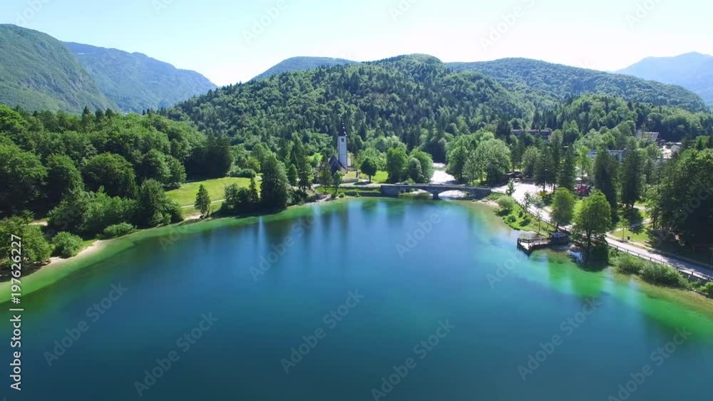 AERIAL VIEW: flight over Bohinj lake, camera moving right to left .Triglav National Park AERIAL VIEW: flight over Bohinj lake, camera moving right to left .Triglav National Park