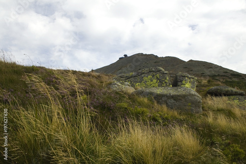 grassy mountain on a cloudy day