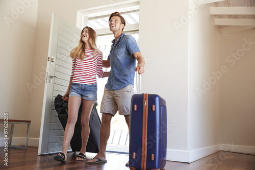 Couple Arriving At Summer Vacation Rental photo