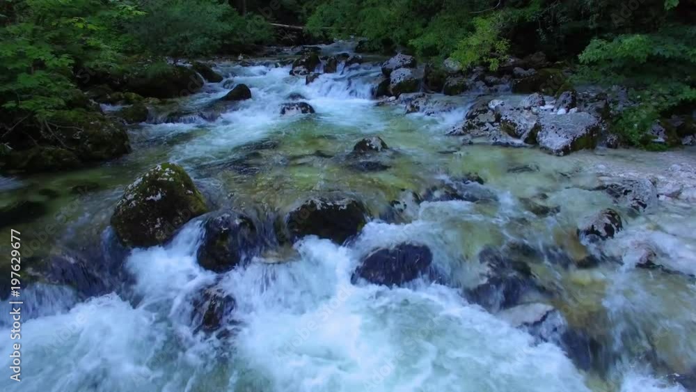 AERIAL view: flight over mountain river. camera moves forwards AERIAL view: flight over mountain river. camera moves forwards