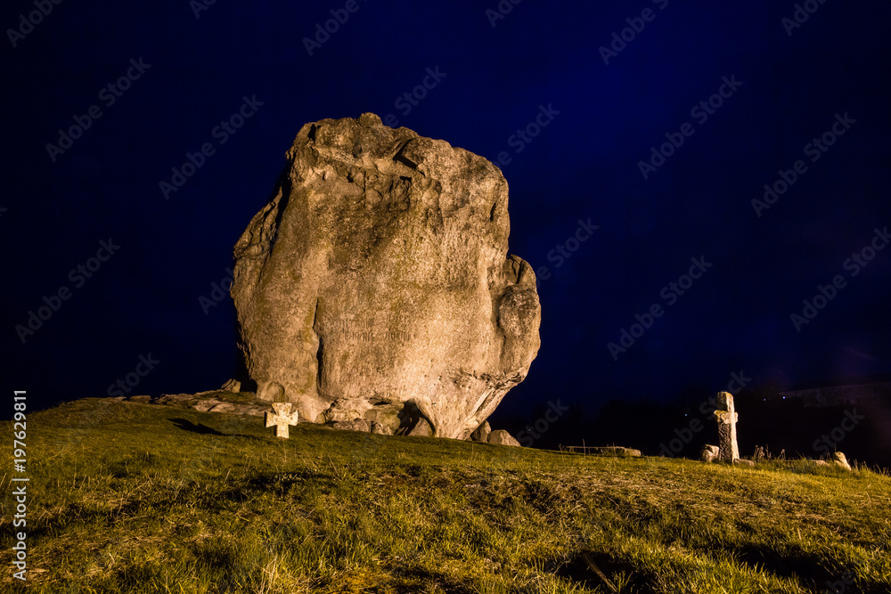 Night view to devil's rock in Pidkamin, Lviv region, West Ukraine (summer landscape)
