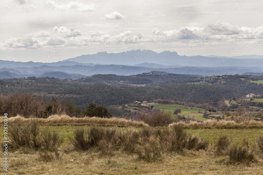 Landscape view with Montserrat mountain at background from village of Moia, province Barcelona, Catalonia, Spain.