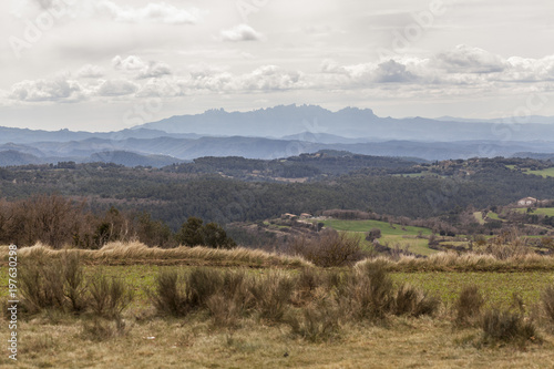 Landscape view with Montserrat mountain at background from village of Moia, province Barcelona, Catalonia, Spain.