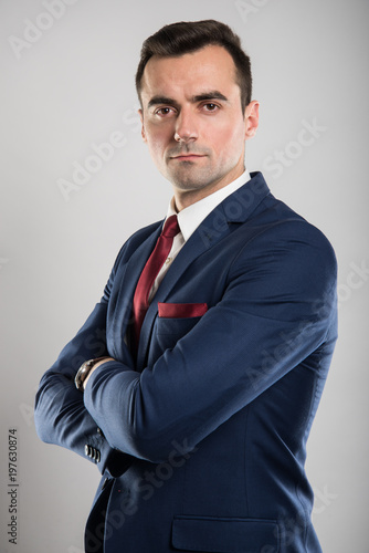 Attractive business man posing with arms crossed