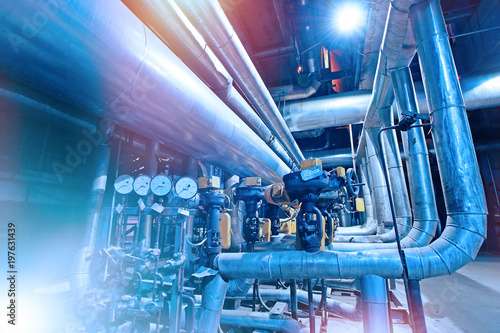 Equipment, cables and piping as found inside of a modern industrial power plant