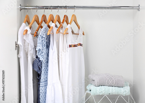 Women clothing on hangers in wardrobe