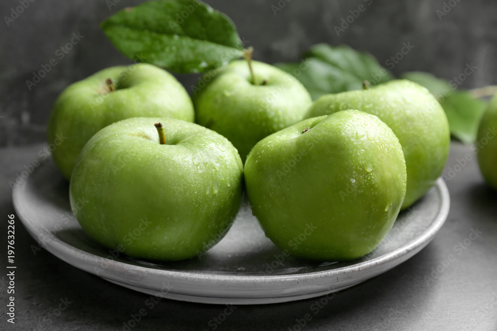 Plate with fresh green apples on table, closeup Plate with fresh green apples on table, closeup