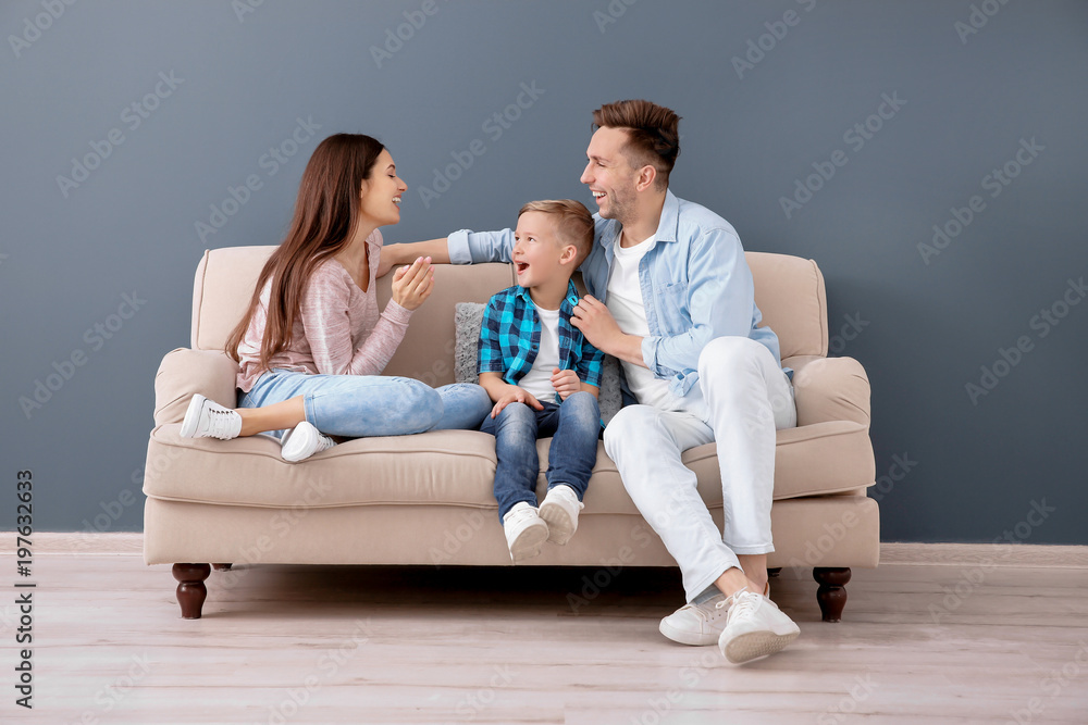 Poster, Print Happy family sitting on sofa, indoors, 40x26.7 cm