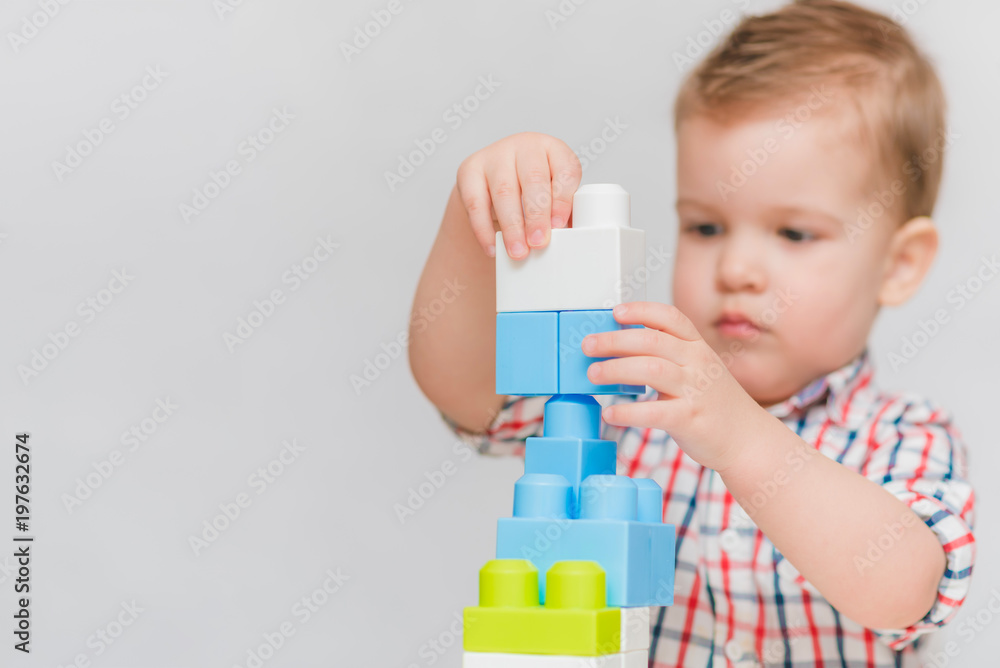 the baby is playing with the designer at home the baby is playing with the designer at home