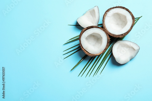 Ripe coconut on color background, top view