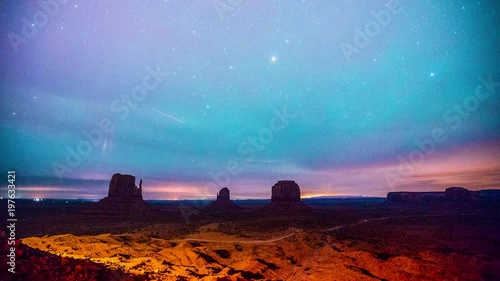 Time Lapse - Clouds Moving Over Monument Valley in a Starry Night