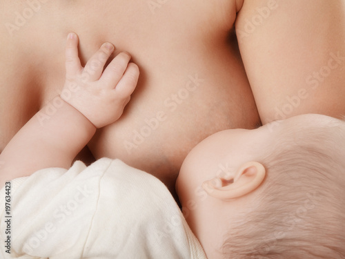 mother breast feeding her newborn baby