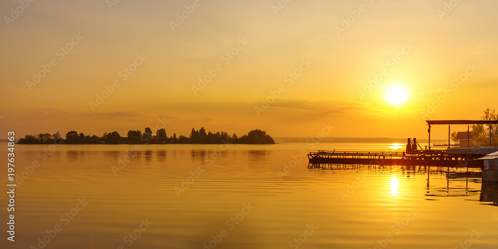 Sunset sun over the island of Voroniy on Lake Seliger Sunset sun over the island of Voroniy on Lake Seliger