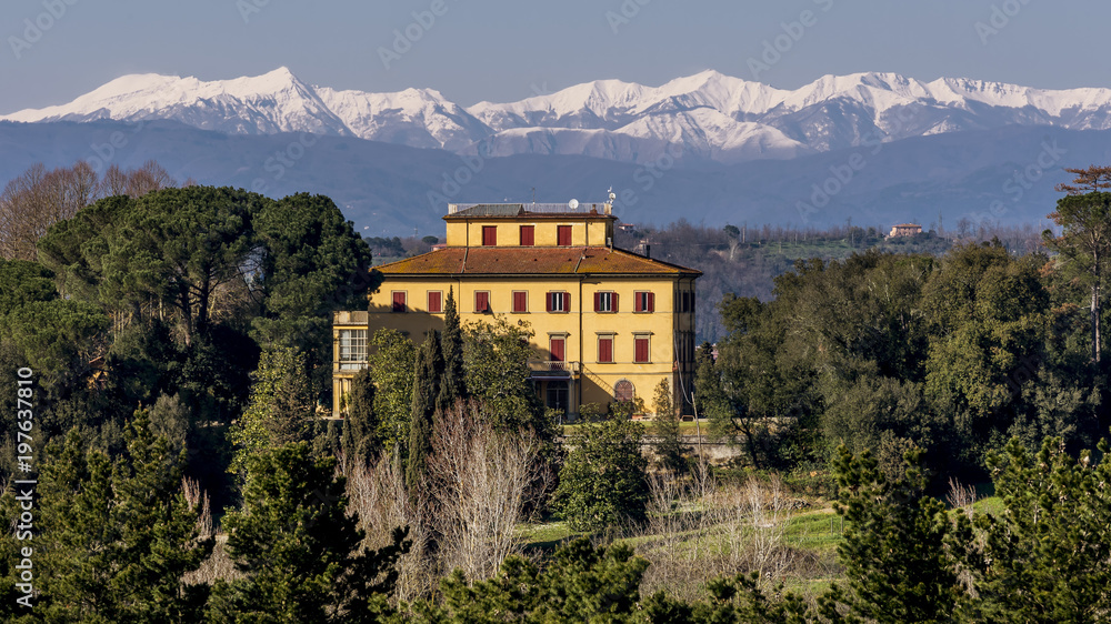 Beautiful Tuscan manor house with snowy mountains in the background, Pontedera, Pisa, Tuscany, Italy