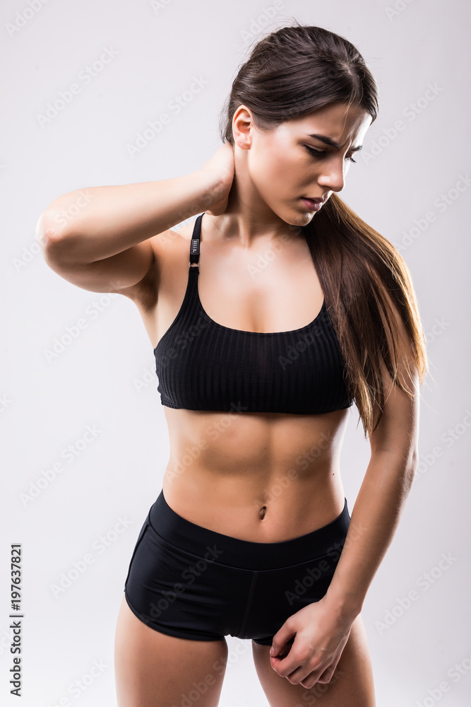 Healthy and Fitness concept - portrait of woman suffers a muscle injury standing holding her neck and lower back with back view. Isolated on white background. Healthy and Fitness concept - portrait of woman suffers a muscle injury standing holding her neck and lower back with back view. Isolated on white background.