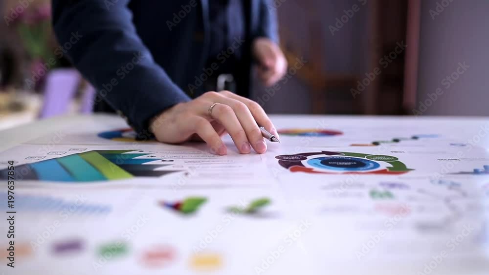 Businessman working in the office with the charts Businessman working in the office with the charts