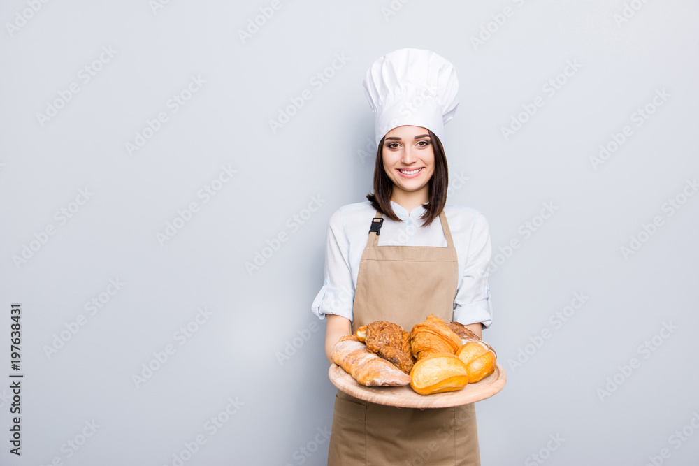 Industry prepare organic natural dough tasty fresh white clothes professional. Portrait of cheerful kind delightful baker demonstrating wooden tray with appetizing food isolated on gray background Industry prepare organic natural dough tasty fresh white clothes professional. Portrait of cheerful kind delightful baker demonstrating wooden tray with appetizing food isolated on gray background