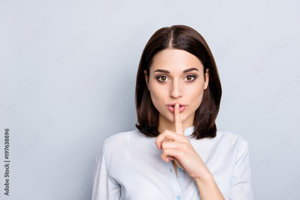 Shh shy sly people person modern concept. Close up portrait of cute lovely attractive uncertain unsure with stylish hairdo entrepreneur making hush gesture isolated on gray background copy-space Shh shy sly people person modern concept. Close up portrait of cute lovely attractive uncertain unsure with stylish hairdo entrepreneur making hush gesture isolated on gray background copy-space