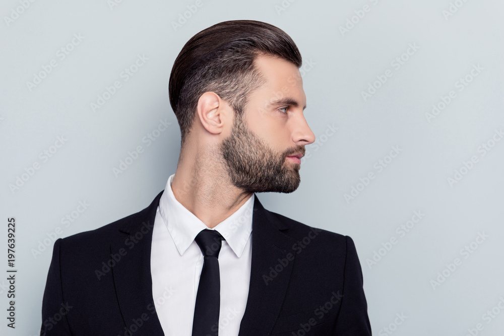 Side half-faced profile portrait of stunning smart clever rich stylish trendy stock marketer broker bureaucrat looking aside wearing white shirt black jacket isolated on gray background copy-space Side half-faced profile portrait of stunning smart clever rich stylish trendy stock marketer broker bureaucrat looking aside wearing white shirt black jacket isolated on gray background copy-space
