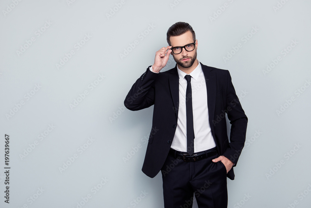 Portrait of smart intelligent handsome virile experienced qualified rich luxurious stylish glamorous clever nerd investor banker broker correcting fixing glasses accessory isolated on gray background Portrait of smart intelligent handsome virile experienced qualified rich luxurious stylish glamorous clever nerd investor banker broker correcting fixing glasses accessory isolated on gray background