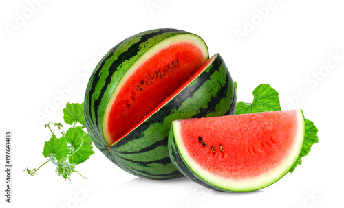 whole and slices watermelon with green leaves isolated on white background