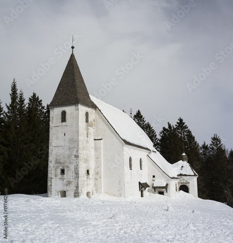 Sveti Areh ( Church of Saint Areh), Pohorje mountains, Maribor, Styria, Slovenia - historical sacral building of Christian church. Slovenian sightseeing, landmark and monument at winter