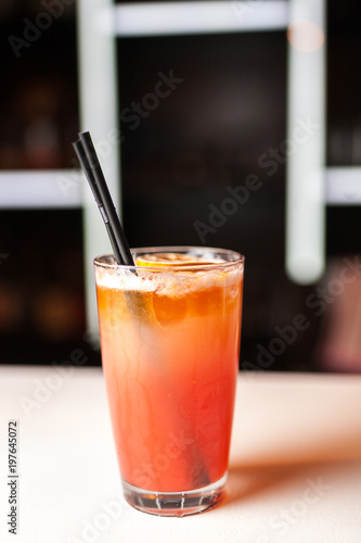 Colorful orange cocktail in bar
