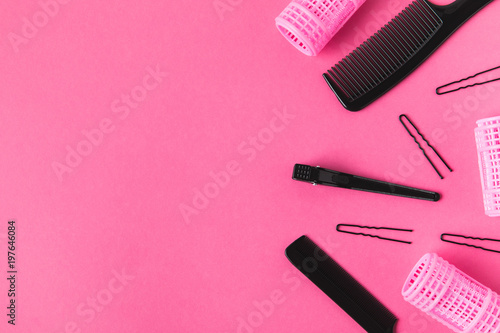 Fototapeta Naklejka Na Ścianę i Meble -  top view of hairdressing tools, isolated on pink