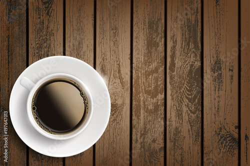 Cup of coffee on a wooden table.