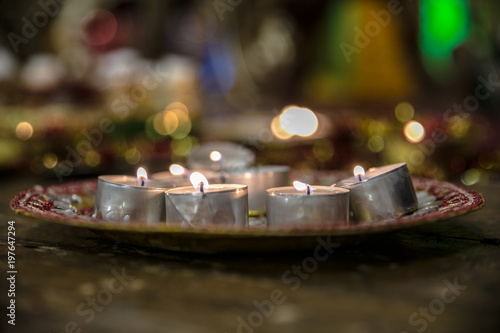 many of candles on plates in Indian dessi wedding photo
