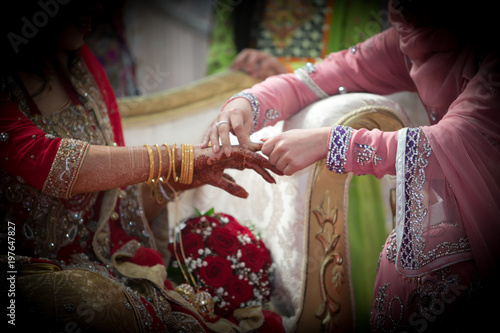 dessi wedding and hands of girls with mehndi photo